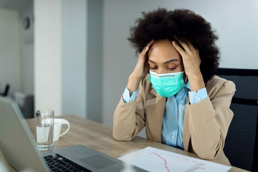 black businesswoman feeling stressed out while working office during coronavirus pandemic opt