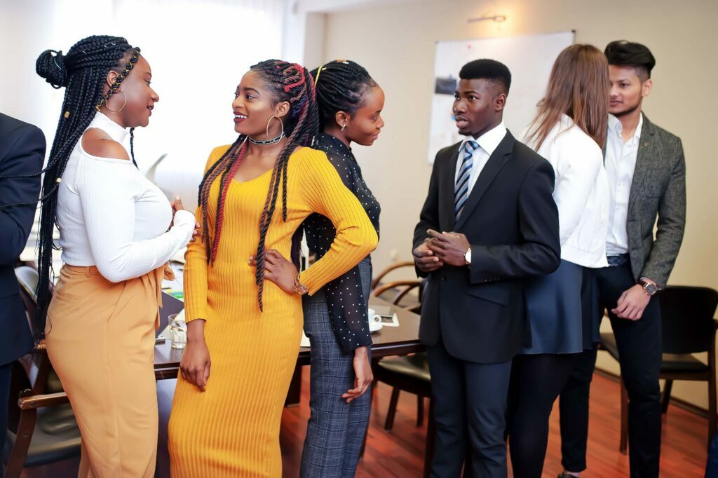 Popular Now: Hyper-Personalization In Hotels 1 multiracial business people standing office discuss together diverse group employees formal wear Copy opt